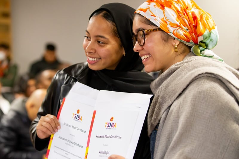 two students receiving an award
